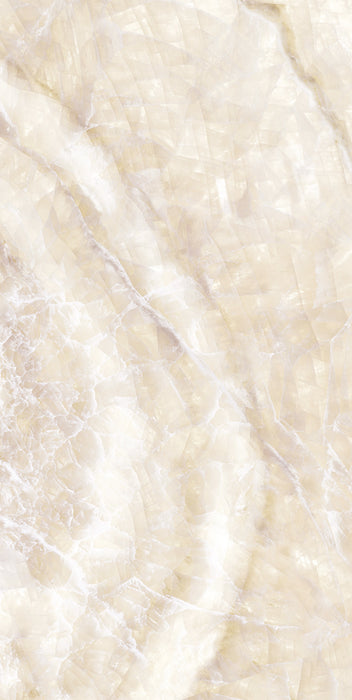 Flat lay of Lumen Precious Stone Ivory 60 × 120cm polished porcelain tiles, showcasing warm ivory and cream gemstone-inspired tones with layered crystalline detailing, soft translucent movement, delicate natural veining, and a reflective high-gloss finish for a luxurious statement surface.
