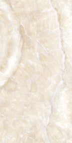 Flat lay of Lumen Precious Stone Ivory 60 × 120cm polished porcelain tiles, showcasing warm ivory and cream gemstone-inspired tones with layered crystalline detailing, soft translucent movement, delicate natural veining, and a reflective high-gloss finish for a luxurious statement surface.