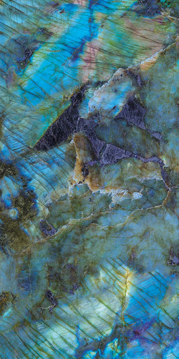 Single tile display of Lumen Precious Stone Labradorite 60 × 120cm polished porcelain tiles, featuring striking blue, teal, and charcoal gemstone-inspired tones with iridescent detailing, layered natural variation, and a luxurious high-gloss finish.