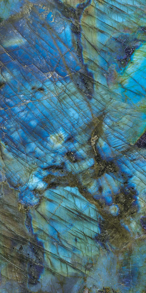 Single tile display of Lumen Precious Stone Labradorite 60 × 120cm polished porcelain tiles, featuring striking blue, teal, and charcoal gemstone-inspired tones with iridescent detailing, layered natural variation, and a luxurious high-gloss finish.