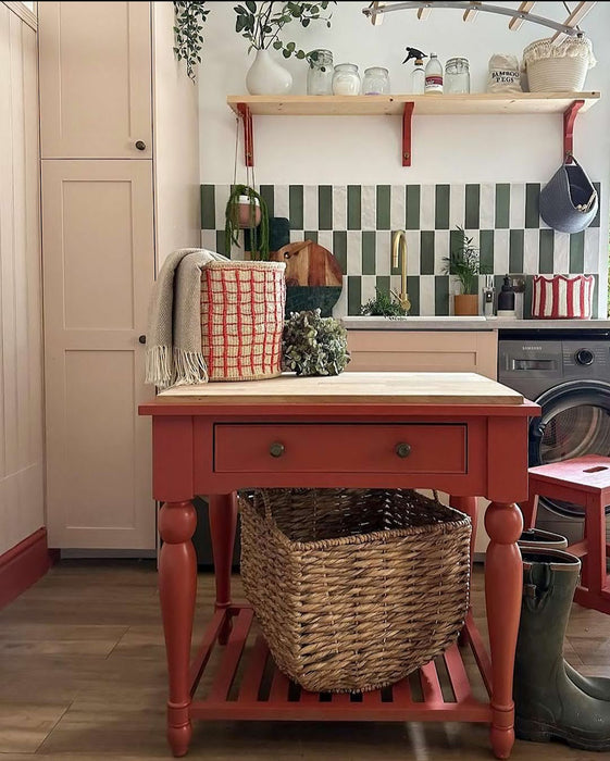 Kitchen interior featuring Zellige Malachite Green and Zellige Oyster 6.5x20cm Moroccan-style brick tiles installed vertically in a striped splashback, styled with brass tap, wooden shelving, and greenery for a warm, contemporary look.