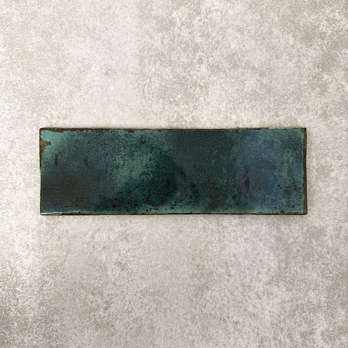 Close-up of Foundry Bricks Marine Blue 6.5x20cm brick wall tile, showcasing deep blue tones with rich tonal variation, lightly textured surface and gently irregular edges for a refined, contemporary finish.