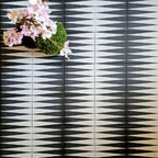 Almeria Backgammon Moroccan-style porcelain wall and floor tiles laid in a repeating black and white geometric pattern, 20x20cm, creating a bold and graphic statement.