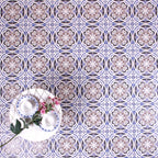 Patterned surface featuring Imperial Victorian Blue Mini Tiles, 15x15cm porcelain tiles with a classic Victorian-inspired design in soft blue, grey, and white tones, styled with decorative tableware and flowers.