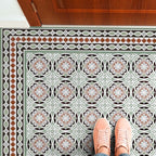 Hallway floor featuring Imperial Victorian Green Mini Border Tiles, 15x15cm porcelain tiles used to frame matching patterned floor tiles, creating a classic Victorian-inspired entrance design.