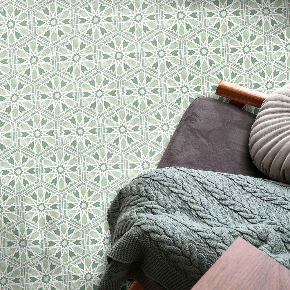Living space featuring Medina Hormuz Verde Green Moroccan-style hexagon porcelain floor tiles, 18.7 × 21.6 cm, laid in a bold geometric pattern and styled with soft furnishings for a relaxed, contemporary look.