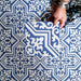 Overhead view of London Streets Thornton Place 20x20cm Victorian Moroccan style porcelain tiles arranged in a repeating blue and white patterned layout.
