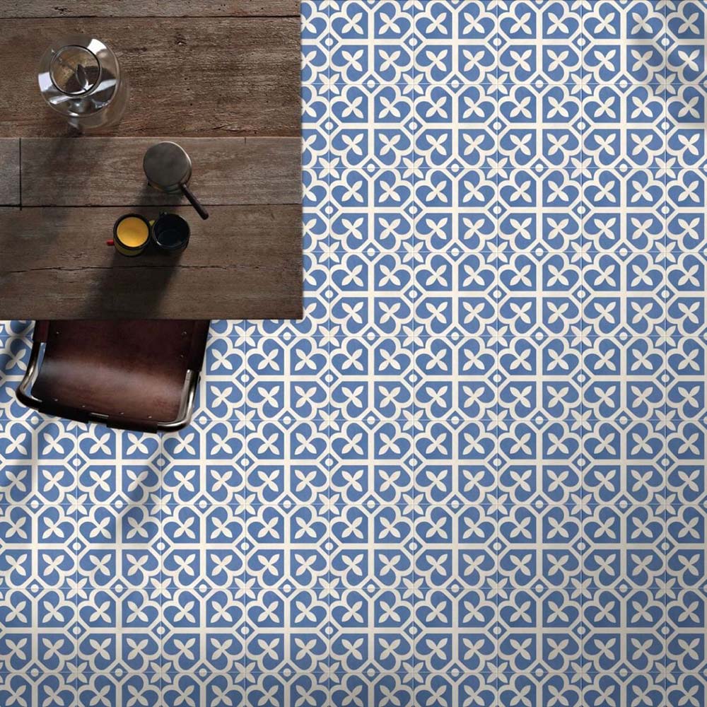 Ivy Blue Victorian Moroccan style 20x20cm patterned tiles, shown as a floor installation beneath a table to highlight the repeating blue and white geometric design.