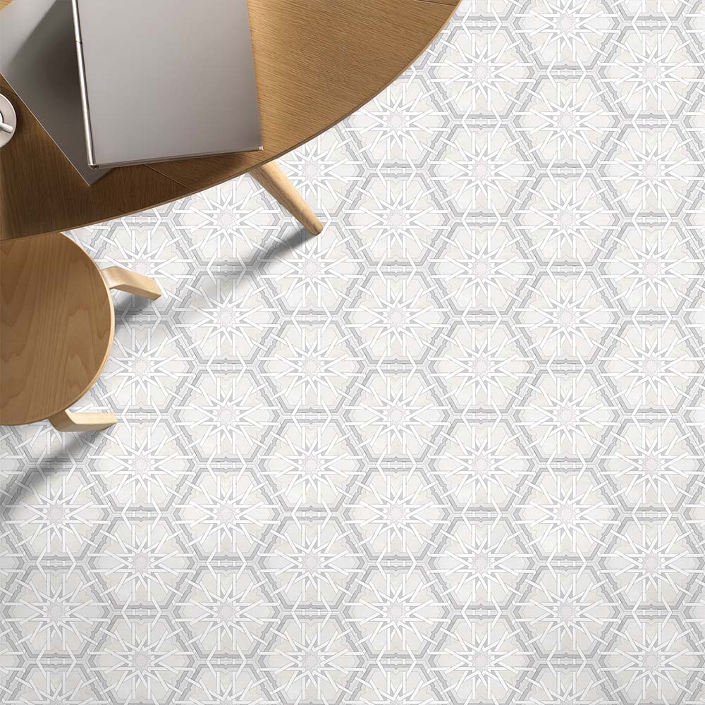 Living space featuring Medina Hormuz Snow White Moroccan-style hexagon porcelain floor tiles, 18.7 × 21.6 cm, laid in a crisp star-inspired geometric pattern and styled with light wood furniture for a clean, modern look.