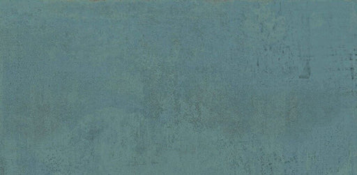 Close-up of Mediterraneo Green 2cm outdoor slabs 50 × 100cm, featuring deep green stone-effect porcelain with subtle tonal variation, textured detailing, and a contemporary concrete-inspired finish suitable for outdoor spaces.