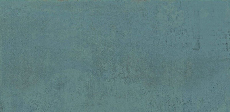 Close-up of Mediterraneo Green 2cm outdoor slabs 50 × 100cm, featuring deep green stone-effect porcelain with subtle tonal variation, textured detailing, and a contemporary concrete-inspired finish suitable for outdoor spaces.