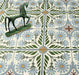 Close-up of Mediterraneo Olbia 2cm patterned outdoor slabs 50 × 100cm, featuring a faded Mediterranean-inspired floral design in soft green, blue, and terracotta tones with a decorative vintage-style finish.