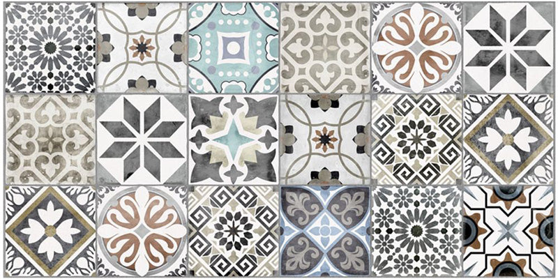 Close-up of Mediterraneo Patchwork 2cm patterned outdoor slabs 50 × 100cm, featuring a decorative patchwork-inspired mix of geometric and floral patterns in soft blue, grey, beige, cream, and terracotta tones.