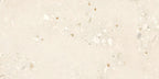 Close-up of Melange Light Cosmo Stone wall and floor tiles 60 × 120cm, featuring soft ivory stone-effect tones with subtle aggregate detailing, delicate texture, and a refined contemporary matt finish.