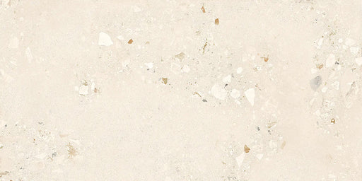 Close-up of Melange Light Cosmo Stone wall and floor tiles 60 × 120cm, featuring soft ivory stone-effect tones with subtle aggregate detailing, delicate texture, and a refined contemporary matt finish.