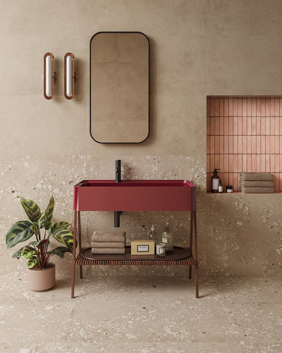 Contemporary bathroom featuring Melange Sand concrete-effect wall and floor tiles 60 × 60cm, showcasing warm sand-toned concrete-inspired detailing with subtle texture, paired with terrazzo accents, blush pink features, and minimalist décor.