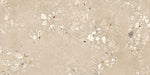Close-up of Melange Sand Cosmo Stone wall and floor tiles 60 × 120cm, featuring warm sand-toned stone-effect detailing with terrazzo-inspired aggregate texture, subtle tonal variation, and a refined contemporary matt finish.