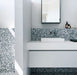Minimalist bathroom featuring Melody POP Terrazzo Blue 60 × 60cm terrazzo-effect porcelain tiles, showcasing soft white stone fragments across a muted blue base, paired with crisp white surfaces, black fixtures, and clean contemporary styling.