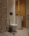 Bathroom featuring Melody POP Terrazzo Green 60cm x 120cm terrazzo effect wall and floor tiles, paired with mustard square wall tiles, minimalist sanitaryware, black fittings and a contemporary walk-in shower.