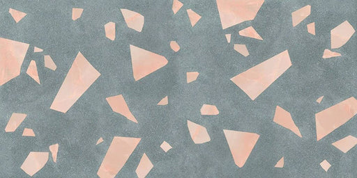 Close-up of Melody ROCK Terrazzo Green 60 × 120cm terrazzo-effect porcelain tiles, featuring oversized blush pink marble-style fragments scattered across a deep green-grey base for a bold contemporary statement finish.