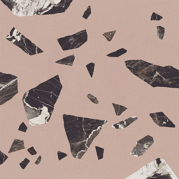 Close-up of Melody ROCK Terrazzo Pink 60 × 60cm terrazzo-effect porcelain tiles, featuring oversized black and white marble-inspired fragments set against a soft blush pink background for a bold, contemporary statement finish.