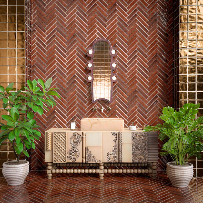 Luxury bathroom featuring Midas Antique Gold Square 13cm x 13cm crackle glaze wall tiles, paired with Levent Butterscotch Brick floor tiles, an ornate vanity, brass accents and lush indoor plants.
