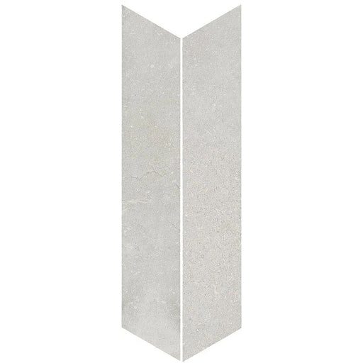 Product display of Monzo Stone Chevron Silver 10x53cm stone-effect porcelain chevron tiles in soft silver-grey tones, featuring subtle texture and natural tonal variation with a contemporary stone-inspired finish.