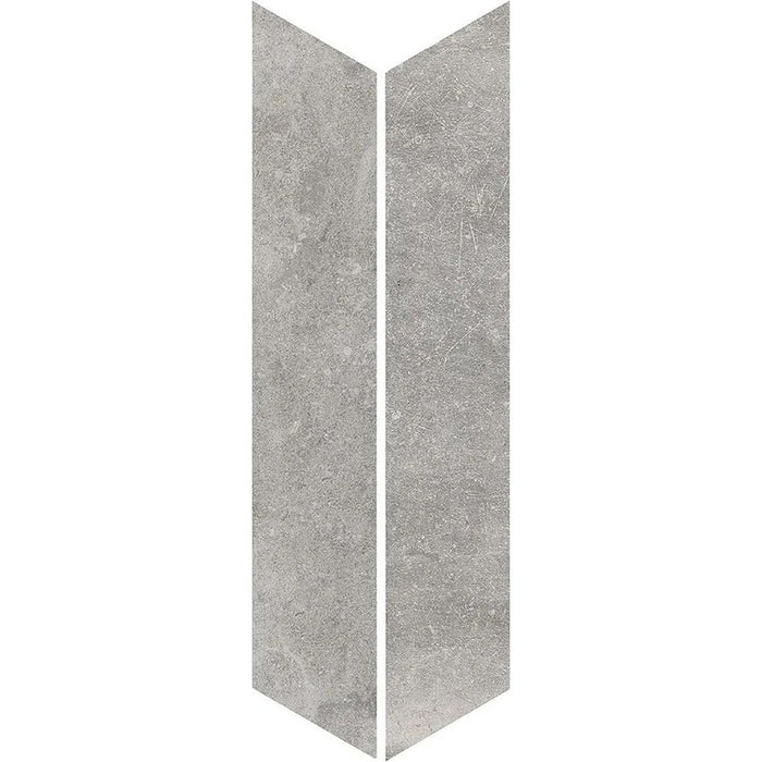 Product display of Monzo Stone Chevron Titanium 10x53cm stone-effect porcelain chevron tiles in soft grey tones, featuring subtle texture and natural tonal variation with a contemporary stone-inspired finish.