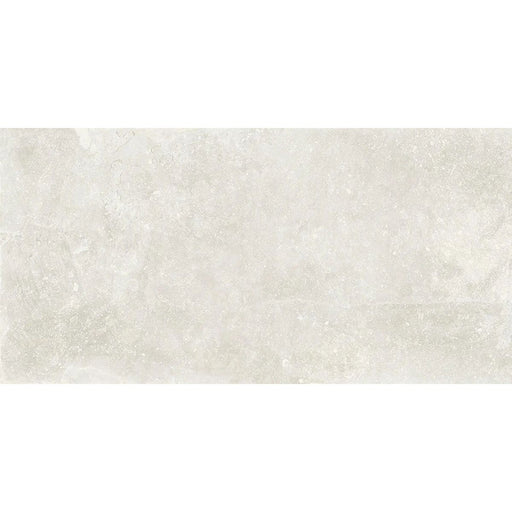 Product display of Monzo Stone Silk 30x60cm stone-effect porcelain tiles in soft ivory tones, featuring subtle texture and tonal variation with a natural stone-inspired finish.