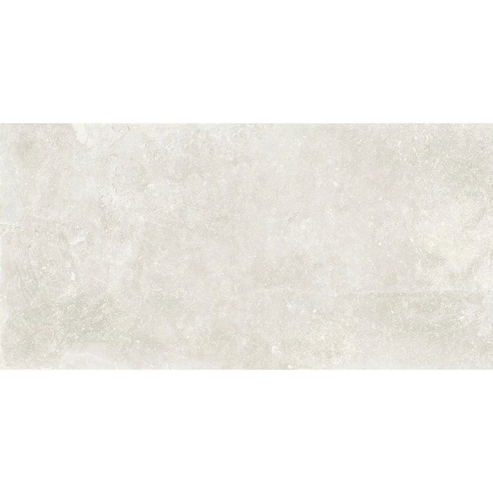 Product display of Monzo Stone Silk 30x60cm stone-effect porcelain tiles in soft ivory tones, featuring subtle texture and tonal variation with a natural stone-inspired finish.
