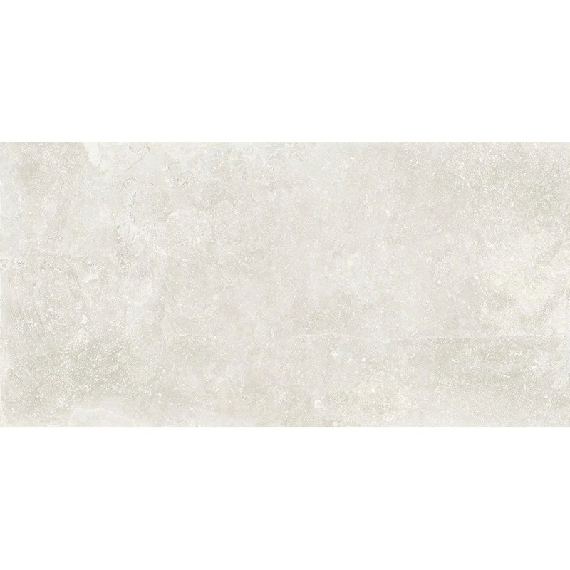 Product display of Monzo Stone Silk 30x60cm stone-effect porcelain tiles in soft ivory tones, featuring subtle texture and tonal variation with a natural stone-inspired finish.