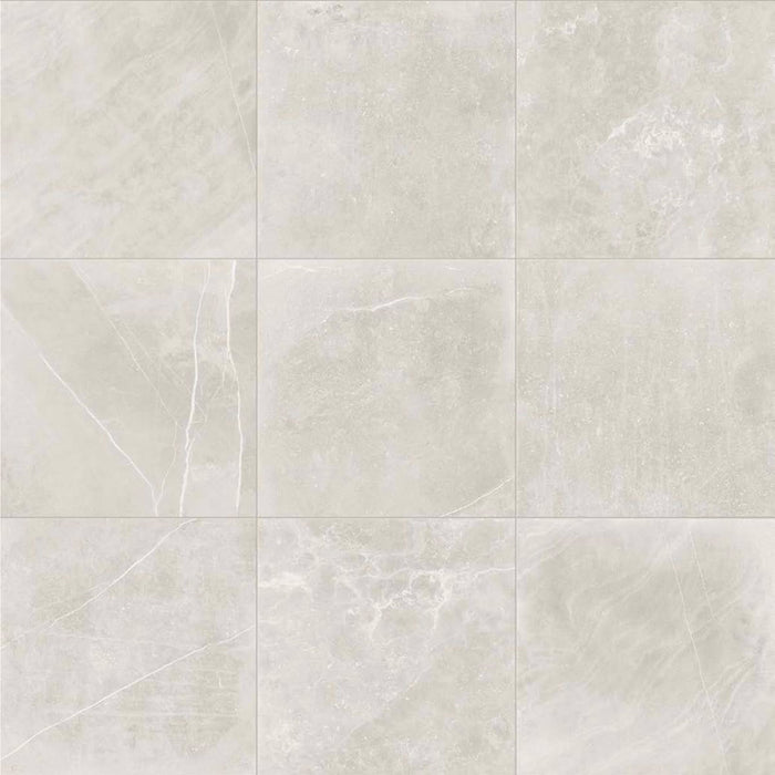 Product display of Monzo Stone Silver 60x60cm stone-effect porcelain tiles in soft silver-grey tones, featuring delicate veining, subtle texture, and natural tonal variation with a contemporary stone-inspired finish.