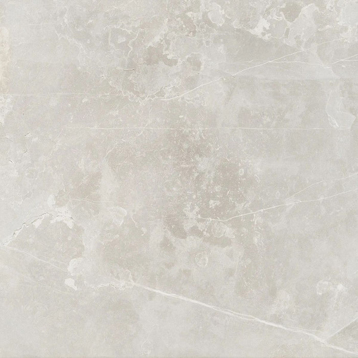 Product display of Monzo Stone Silver 60x60cm stone-effect porcelain tiles in soft silver-grey tones, featuring delicate veining, subtle texture, and natural tonal variation with a contemporary stone-inspired finish.