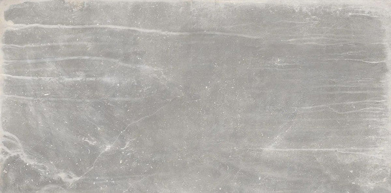Product display of Monzo Stone Titanium 30x60cm stone-effect porcelain tiles in soft grey tones, featuring subtle texture, layered veining, and tonal variation with a natural stone-inspired finish.