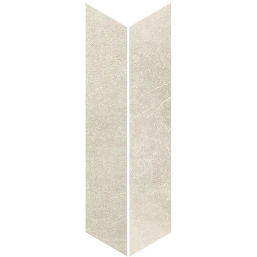 Product display of Monzo Stone Chevron Sand 10x53cm chevron porcelain tiles in soft warm beige tones, featuring subtle stone-effect texture, delicate veining and a contemporary geometric chevron shape inspired by natural stone surfaces.