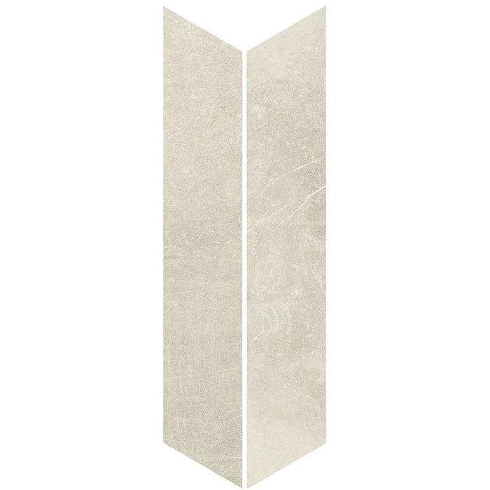 Product display of Monzo Stone Chevron Sand 10x53cm chevron porcelain tiles in soft warm beige tones, featuring subtle stone-effect texture, delicate veining and a contemporary geometric chevron shape inspired by natural stone surfaces.