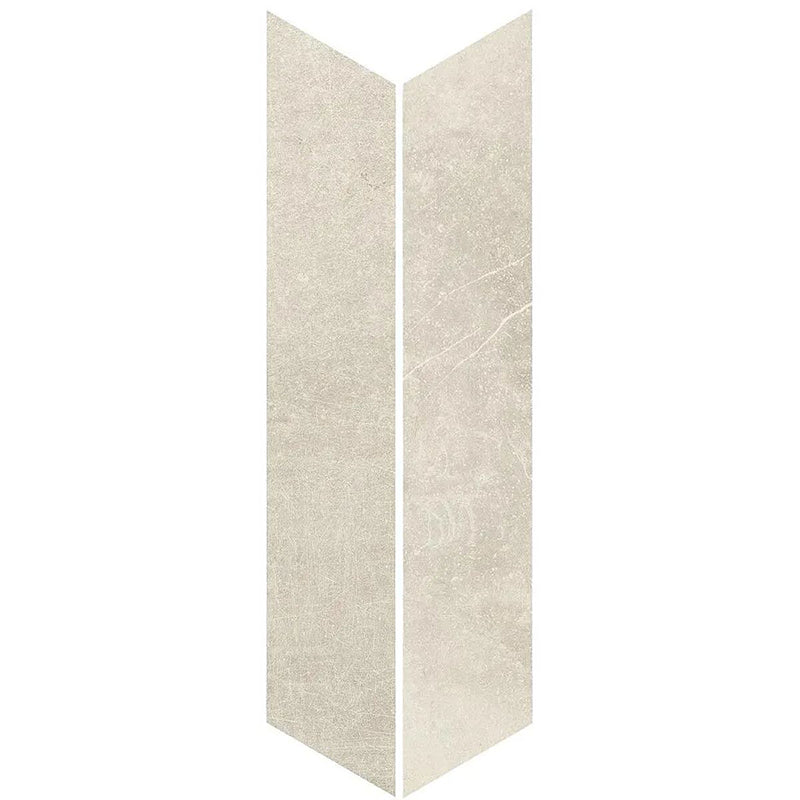Product display of Monzo Stone Chevron Sand 10x53cm chevron porcelain tiles in soft warm beige tones, featuring subtle stone-effect texture, delicate veining and a contemporary geometric chevron shape inspired by natural stone surfaces.