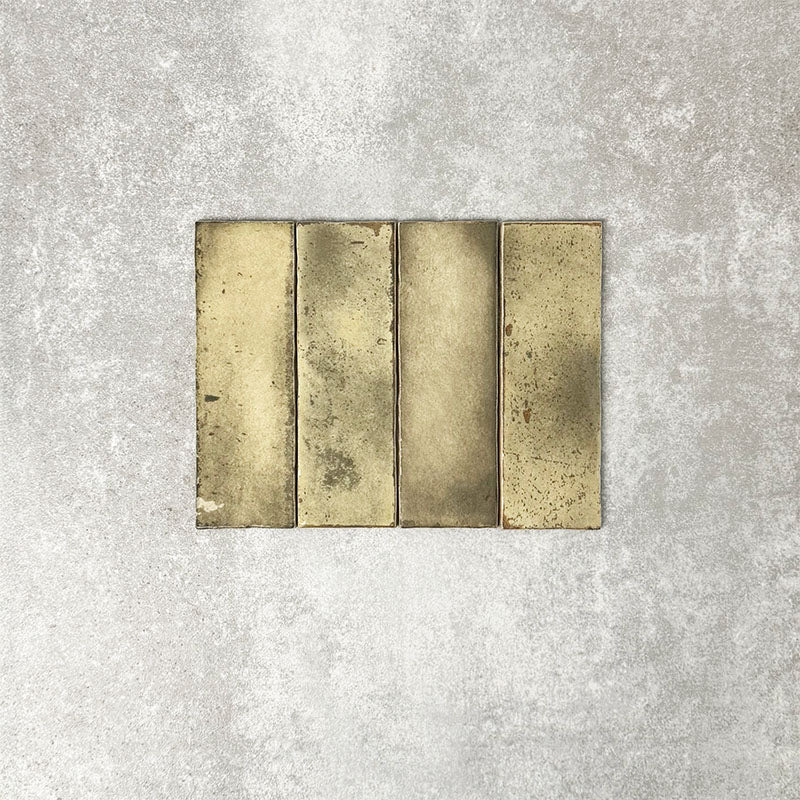 Close-up of Foundry Bricks Moss Green 6.5x20cm brick wall tiles, showcasing earthy green tones with rich tonal variation, lightly textured surfaces and gently irregular edges for a refined, contemporary finish.