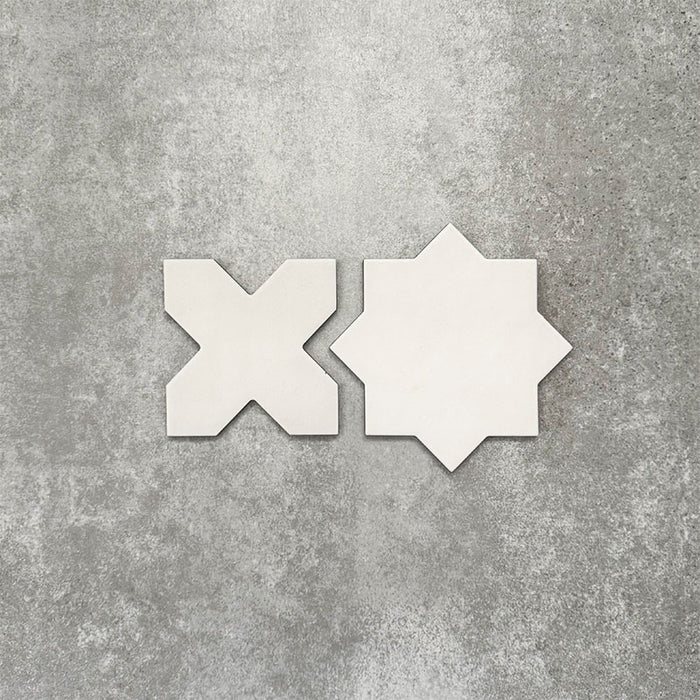 Close-up of Muscat Bone Star and Cross Moroccan-style porcelain wall and floor tiles, showcasing coordinating geometric shapes, soft bone white tones and a smooth matt finish.