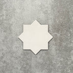 Close-up of Muscat Bone Star Moroccan-style porcelain wall and floor tile, showcasing an eight-point geometric star shape, soft bone white tone and smooth matt finish.