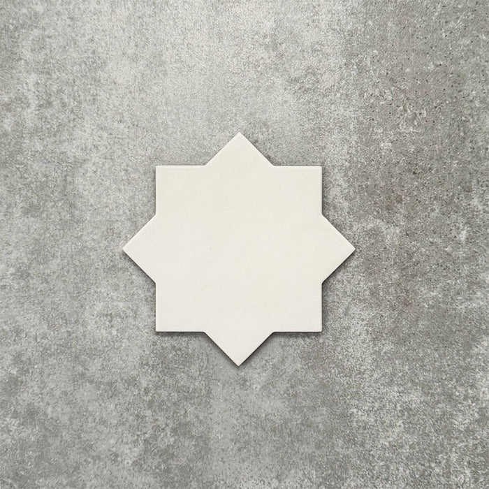 Close-up of Muscat Bone Star Moroccan-style porcelain wall and floor tile, showcasing an eight-point geometric star shape, soft bone white tone and smooth matt finish.