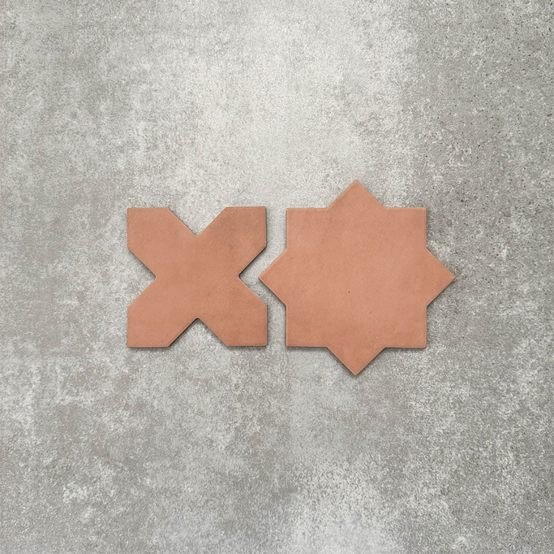 Close-up of Muscat Cotto Star and Cross Moroccan-style porcelain wall and floor tiles, showcasing coordinating geometric shapes, warm terracotta tones and a smooth matt finish.