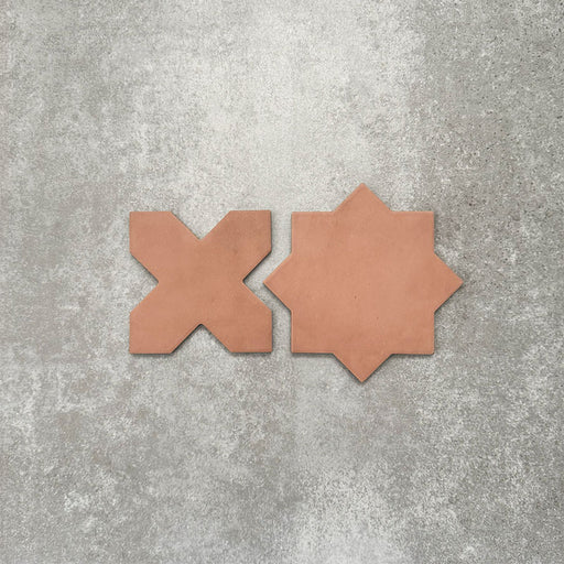 Close-up of Muscat Cotto Star and Cross Moroccan-style porcelain wall and floor tiles, showcasing coordinating geometric shapes, warm terracotta tones and a smooth matt finish.