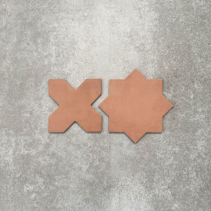 Close-up of Muscat Cotto Star and Cross Moroccan-style porcelain wall and floor tiles, showcasing coordinating geometric shapes, warm terracotta tones and a smooth matt finish.