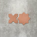 Close-up of Muscat Cotto Star and Cross Moroccan-style porcelain wall and floor tiles, showcasing coordinating geometric shapes, warm terracotta tones and a smooth matt finish.