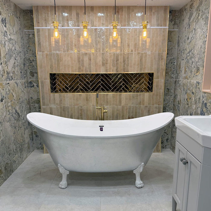 Bathroom featuring Museo Warm Stone Matt 60x120cm porcelain wall tiles, showcasing a dramatic marble effect design in warm beige, ivory and grey tones, paired with a freestanding bath, brass fittings and textured feature wall tiles.