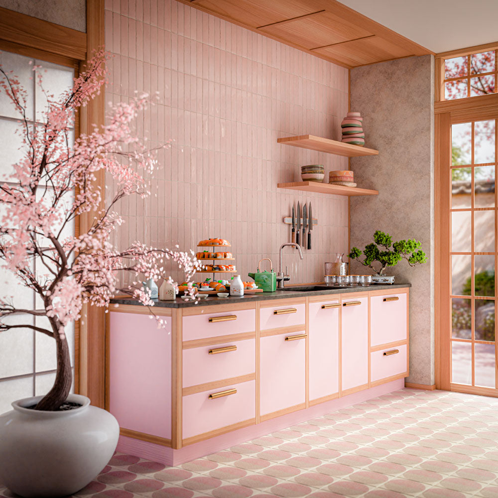 Nomad Rose Brick 6cm x 24.6cm industrial style wall tiles, featuring soft blush pink tones and subtle shade variation across the kitchen splashback, paired with pink cabinetry, warm wood details and patterned flooring.