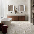 Bathroom featuring Nucetto Travertine Decor 60x60cm wall and floor tiles, showcasing a geometric travertine effect pattern, paired with matching travertine effect wall tiles, a freestanding bath, timber vanity unit and contemporary black accents.