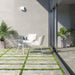 Outdoor seating area featuring Boho Ocean Blend 2cm 50 × 100cm patterned slabs, blending soft neutral and blue tones with a gently weathered effect. Ideal for patios and garden pathways, creating a relaxed, natural outdoor setting.