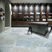 Interior featuring Boho Ocean Blue 60 × 60cm patterned floor tiles, blending soft blue and muted tones with a worn, decorative effect. Ideal for adding character to contemporary spaces such as retail interiors, kitchens, or open-plan living areas.